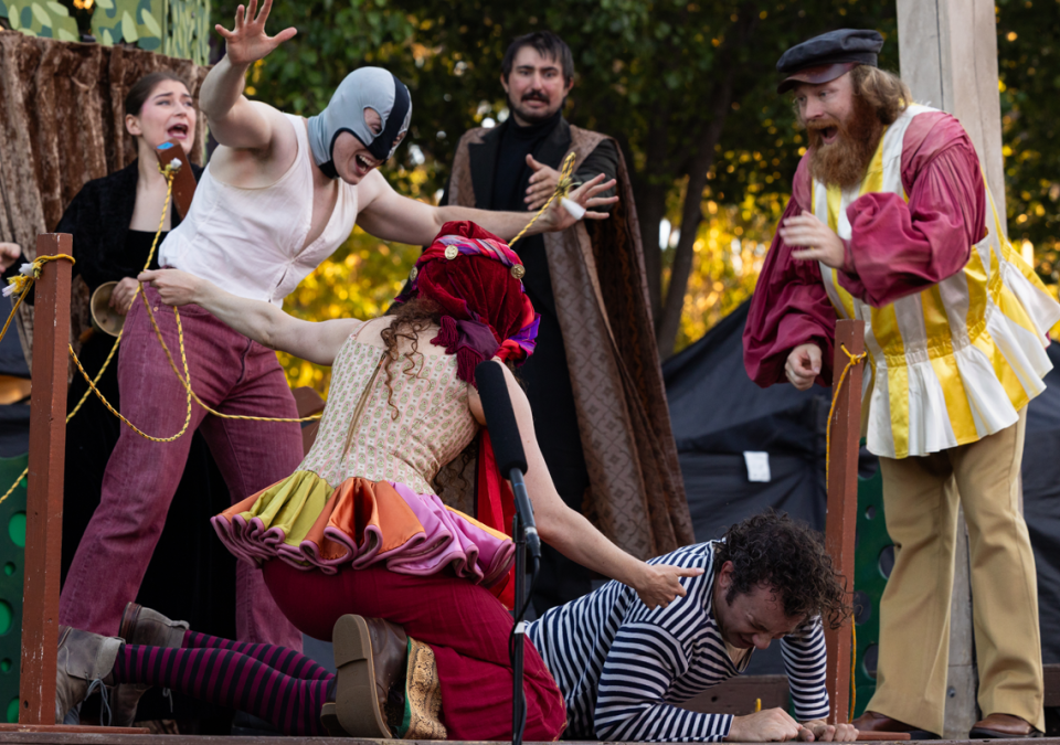 Costumed actors perform Shakespeare
