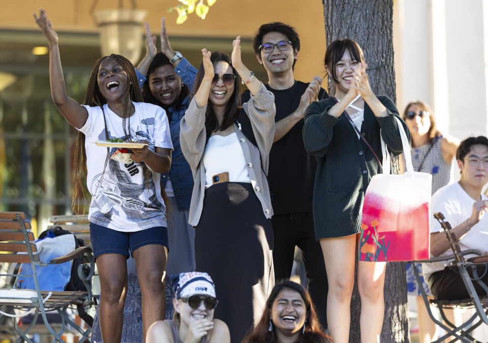 Students applaud during a welcome back event on SUA's campus.