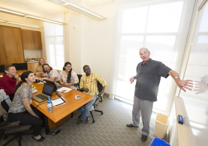 Professor instructs six graduate students in a typically intimate Soka class