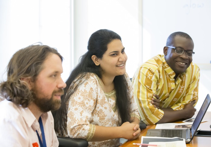 Image of graduate students in class.