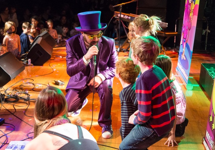 Secret Agent 23 Skidoo performing on stage with kids