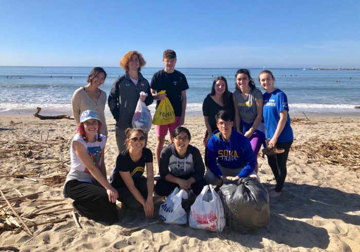 Photo of student-athletes at beach clean up activity