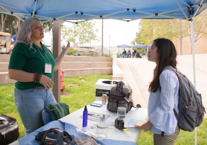 Image of a student speaking to employer at Career Fair.