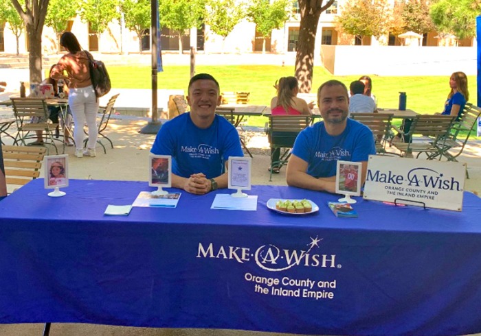 Soka students staff a Make a Wish foundation table