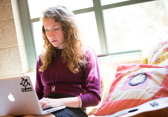 Student works on laptop in residence hall