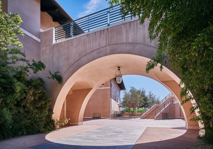 Archway under pedestrian bridge on campus