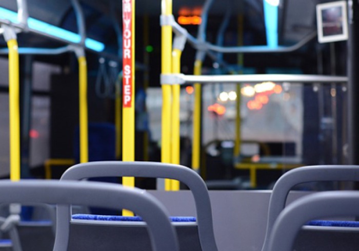 Interior of empty public bus at night