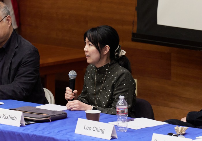 Yuka Kishida speaks into the microphone