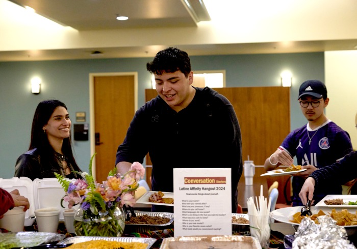 Students serve themselves food during an Affinity Hangout