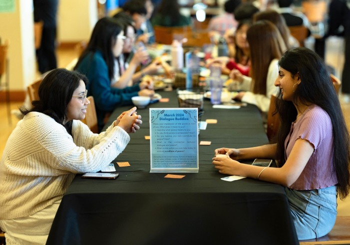 Students participate in a DEI discussion in the Bistro