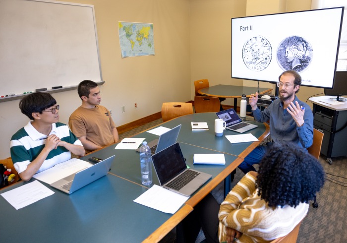 A professor is giving a lecture to 3 students