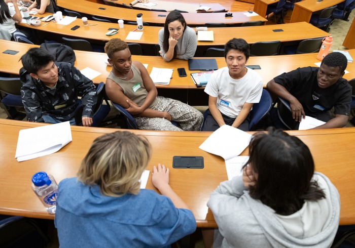 Students participate in a discussion during class