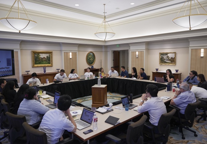 Conference attendees take part in a large group discussion