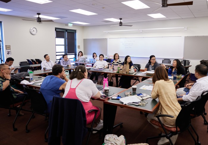 Attendees of the conference participate in a discussion