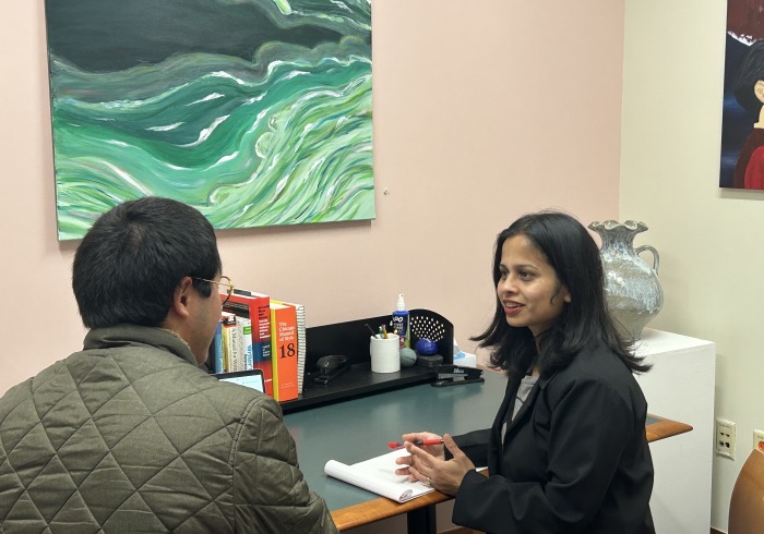 Image of Sanchaika tutoring a student
