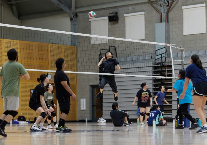 Students and staff participate in volleyball intramurals.