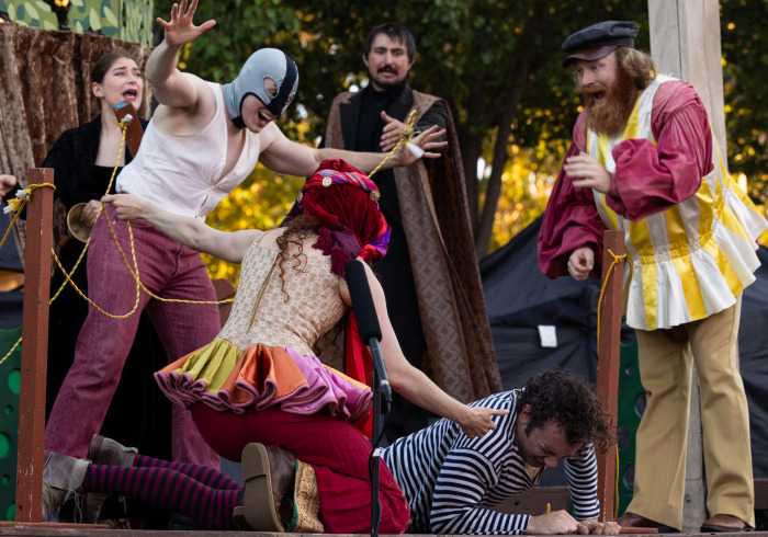 Costumed actors perform Shakespeare