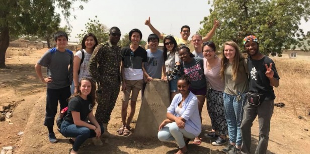 Students gather for group photo during travel learning cluster in Ghana