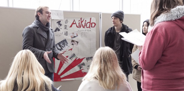 A professor speaks to students