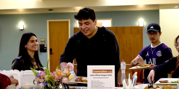 Students serve themselves food during an Affinity Hangout