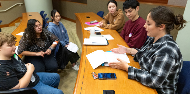 Students participate in a group discussion during class.