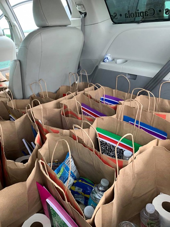 Donation bags in the backseat of a car