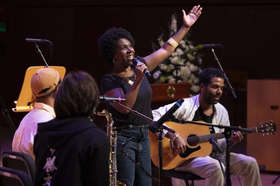 Lucas' mother performs a song with two of her sons during the memorial service.