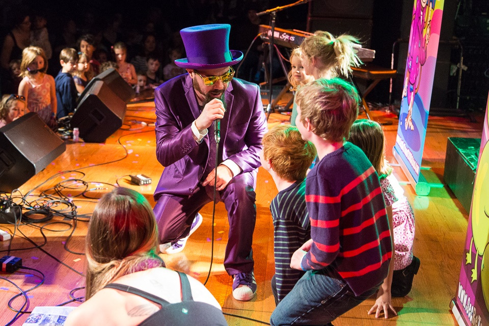 Secret Agent 23 Skidoo performing on stage with kids
