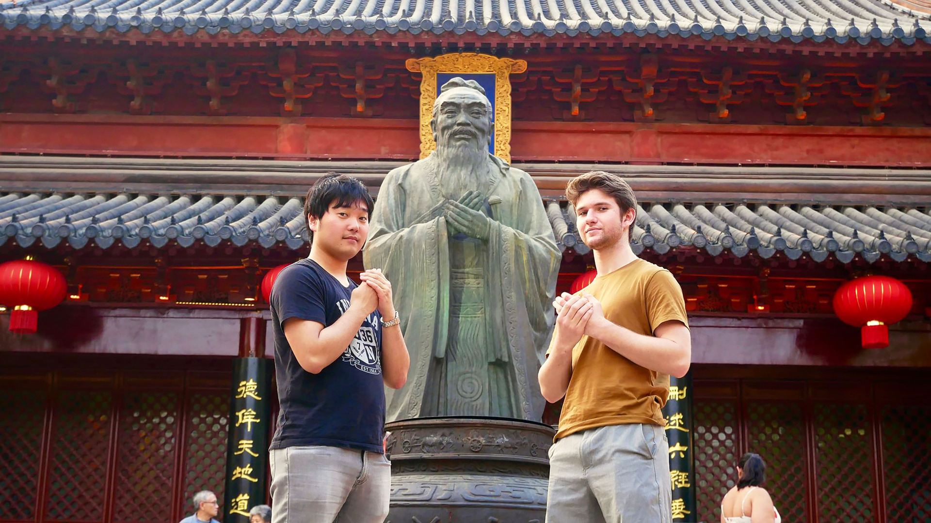 Two students with statue in Shanghai