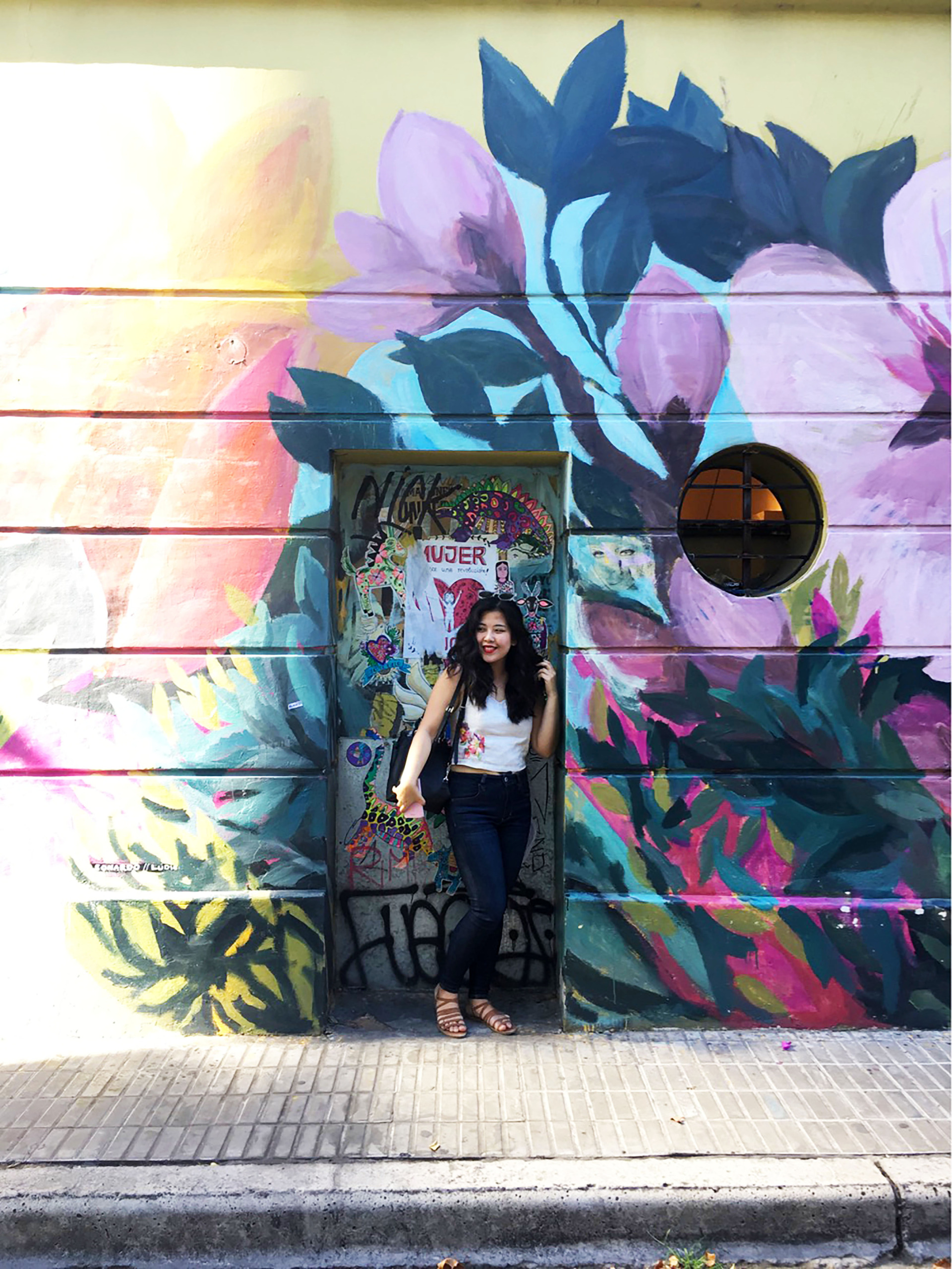 Student in front of graffiti in Buenos Aires