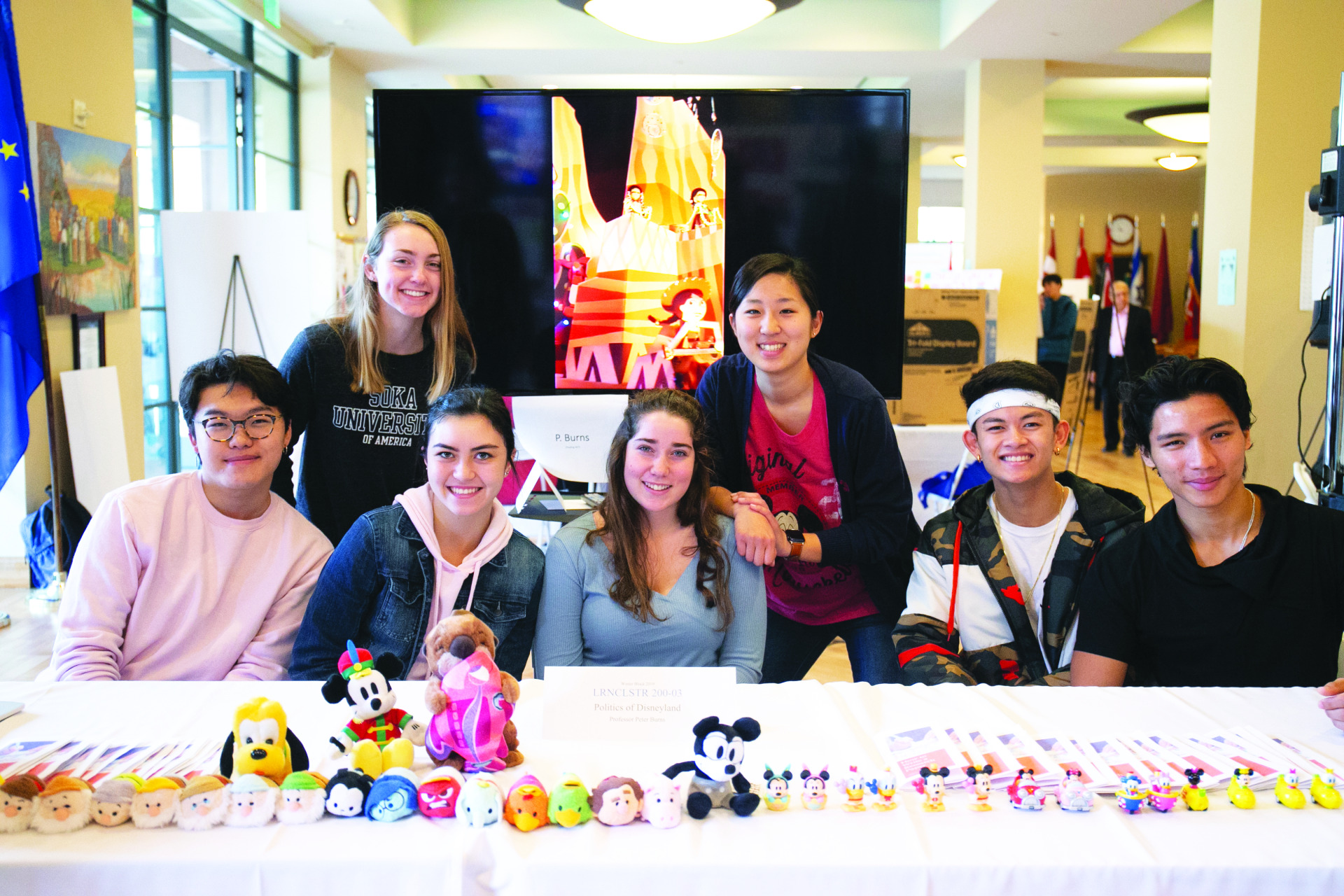 Image of students at a booth at the Learning Cluster fair.