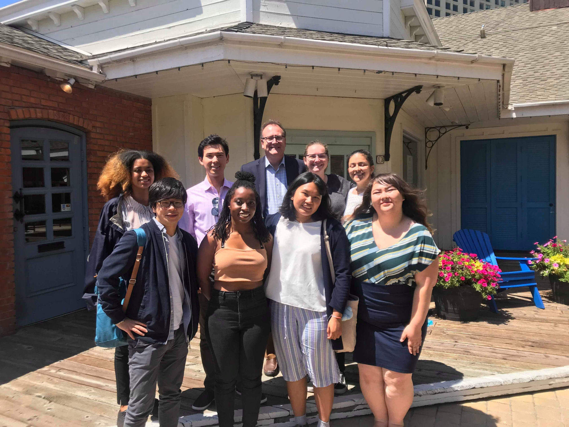 Image of a professor with students.