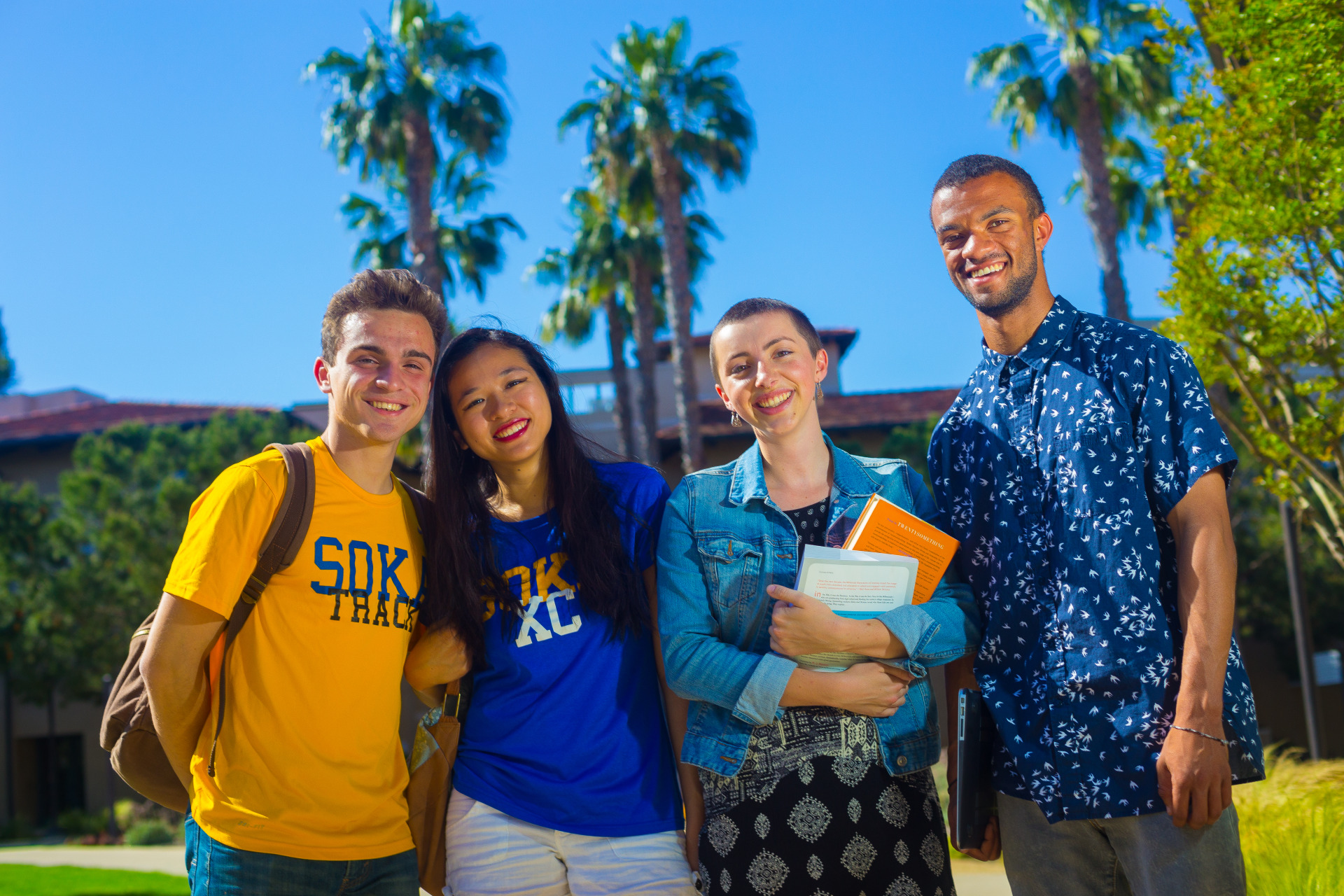 Image of a group of students smiling.