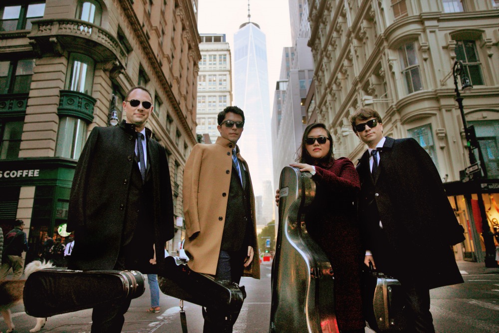 Calidore String Quartet members standing in New York City