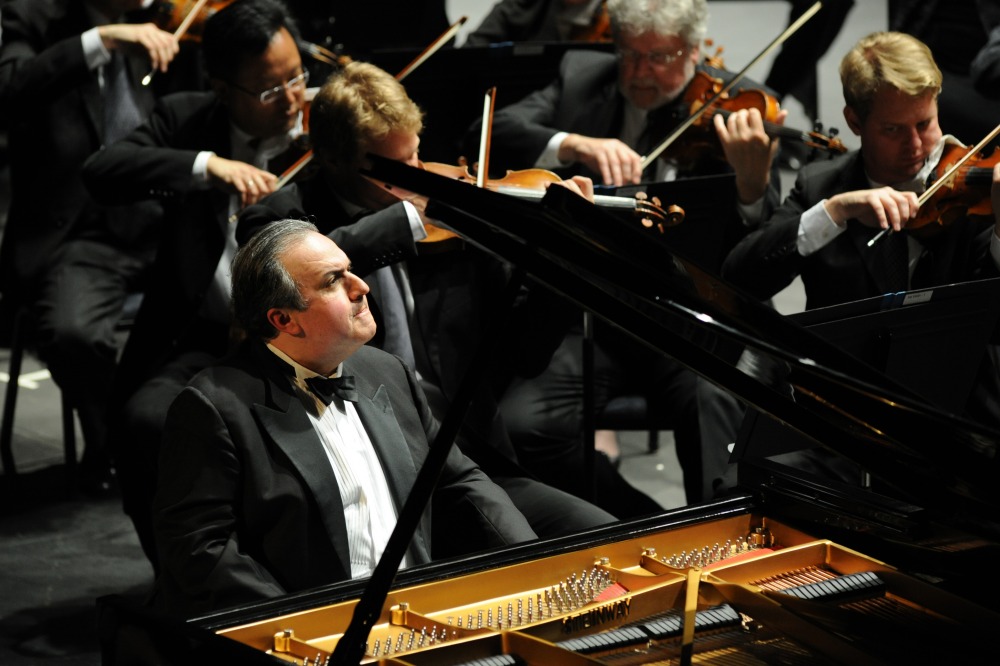 Yefim Bronfman sitting at piano at concert