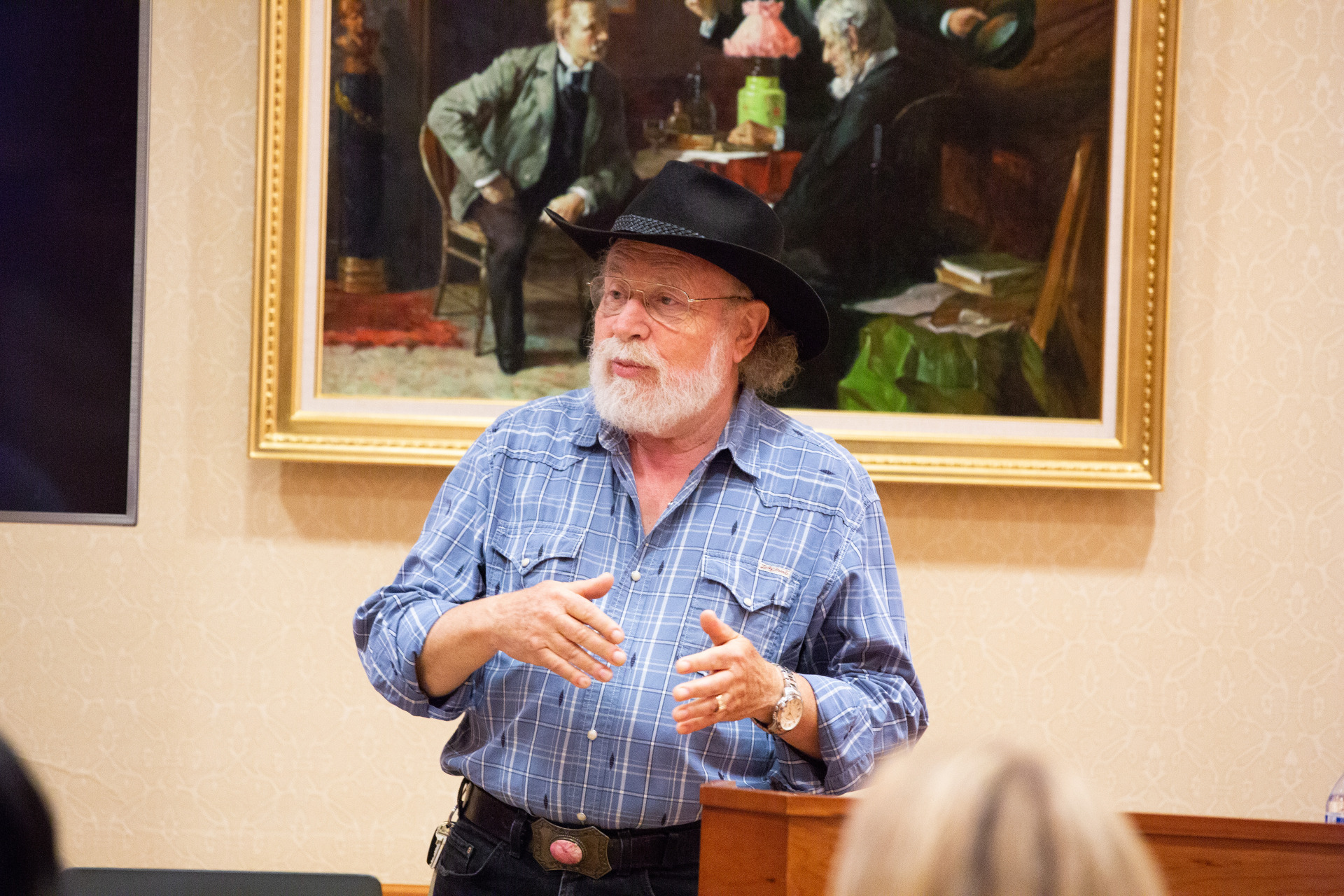 Image of Arie Galles speaking at an event.