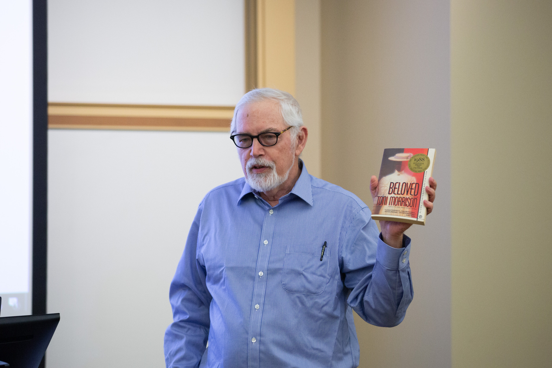 Professor Jonathan Arac holding Toni Morrison's Beloved
