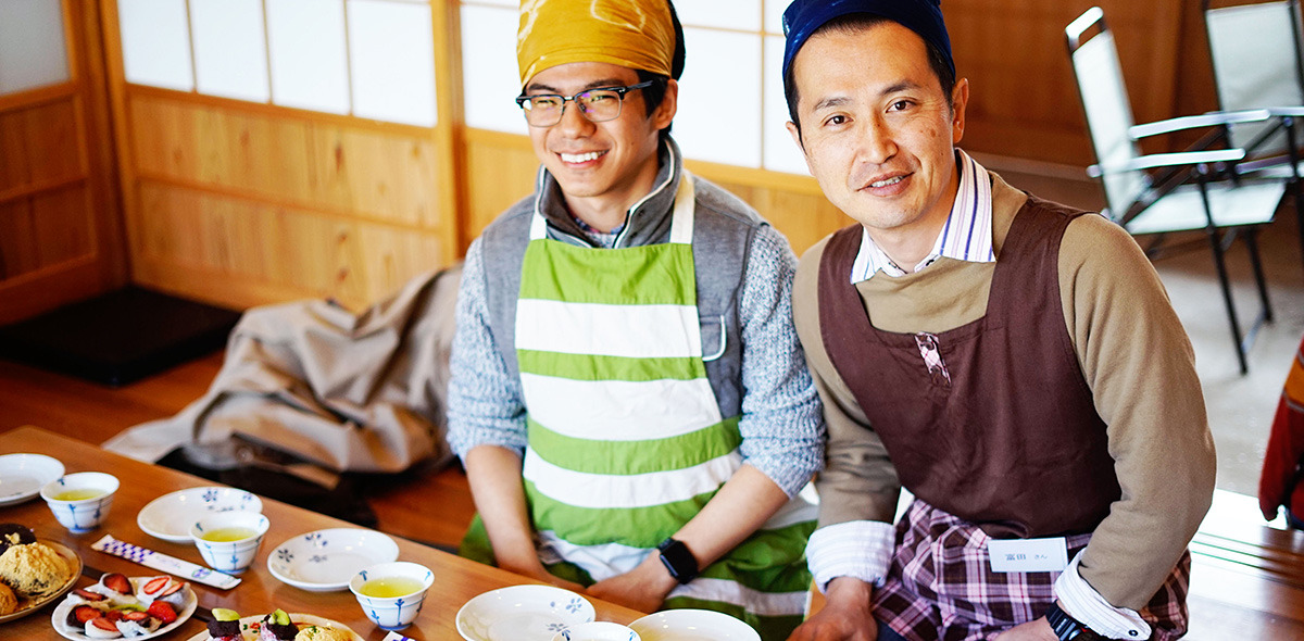 Student and professor at dining table