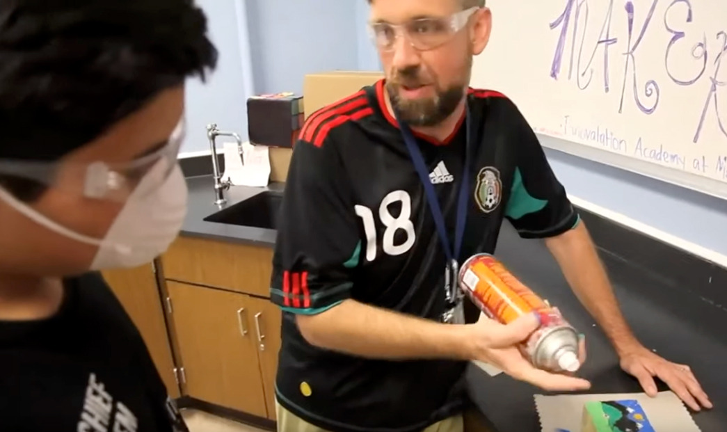 Teacher instructing student about creating a mini-mural 