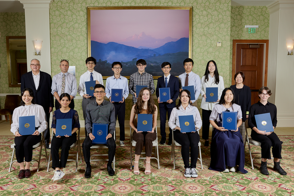 Recipients of Soka University of America’s top academic honors pose for a photo with their awards.