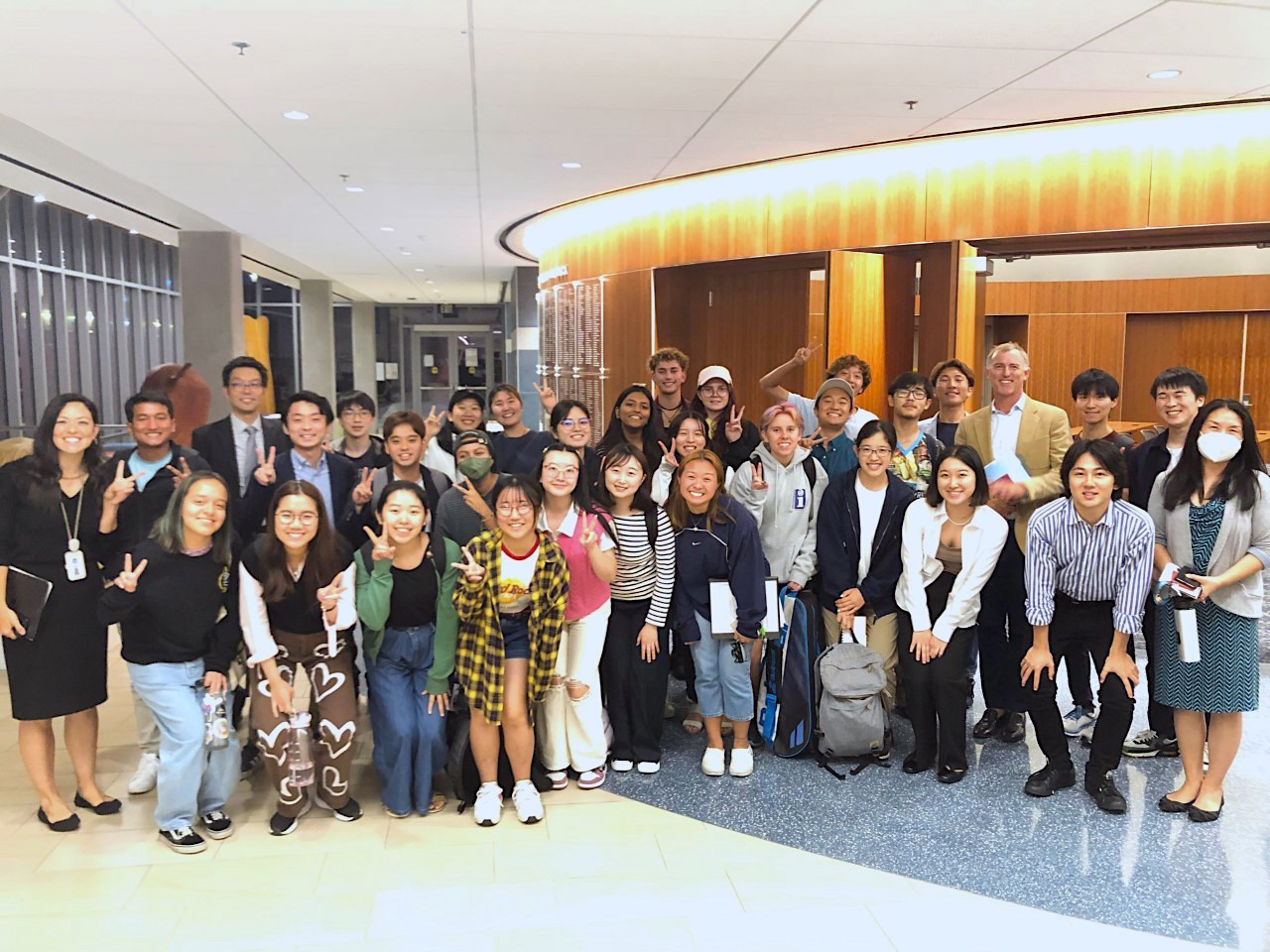 Soka students and faculty pose and smile