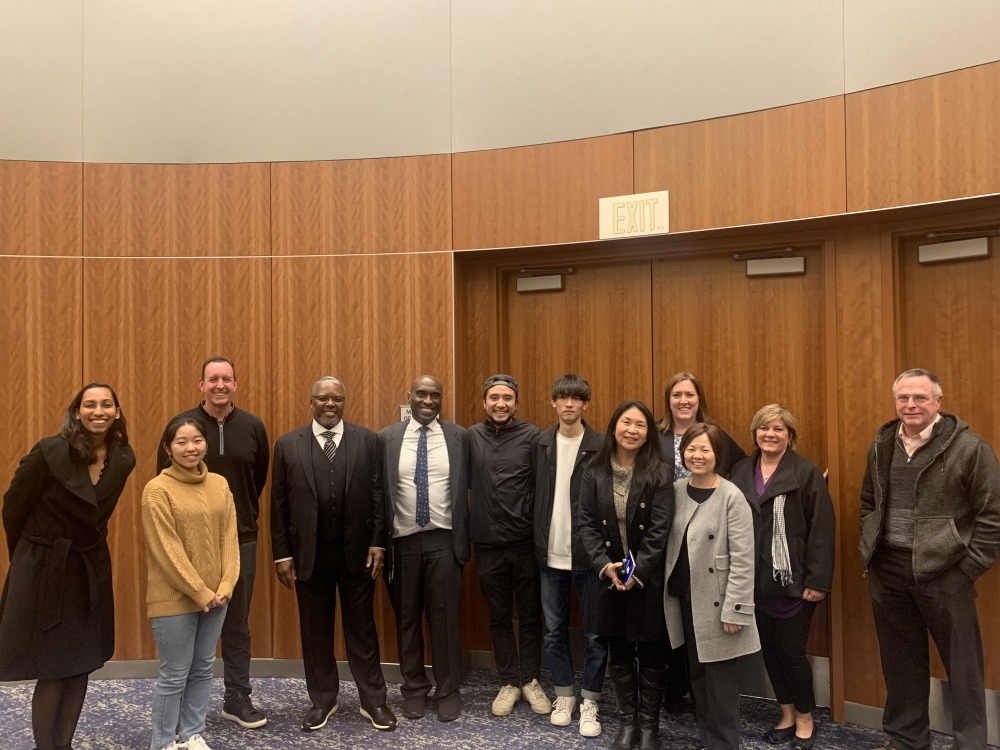 Reverend Dr. Reginald E. Bachus poses with SUA Faculty and students