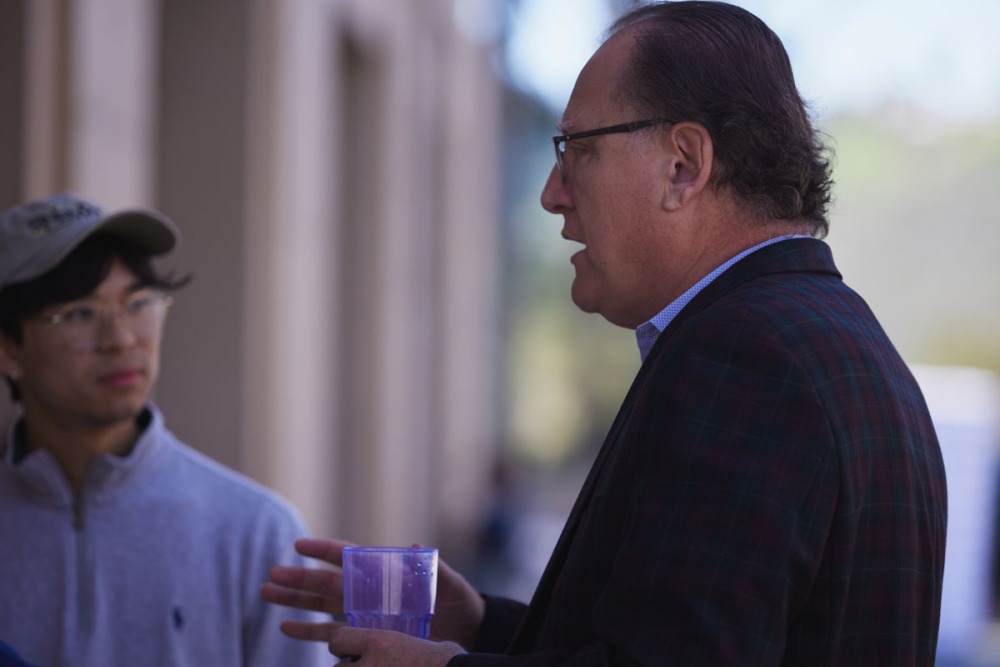 A student is listening intently to a professor