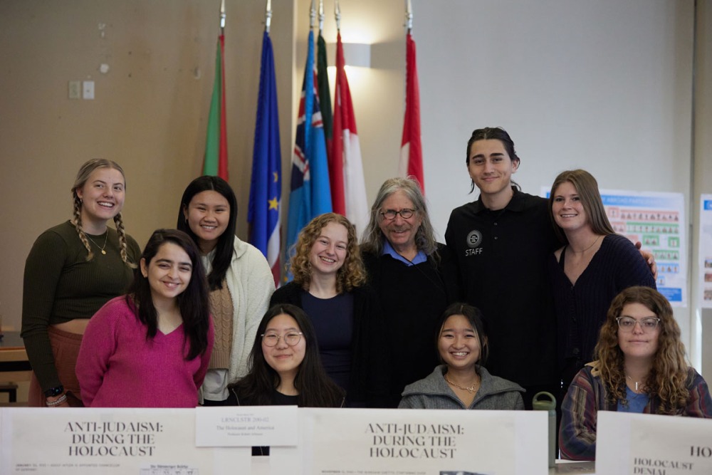 Students pose with Professor Robert Allinson during "The Holocaust and America" Learning Cluster