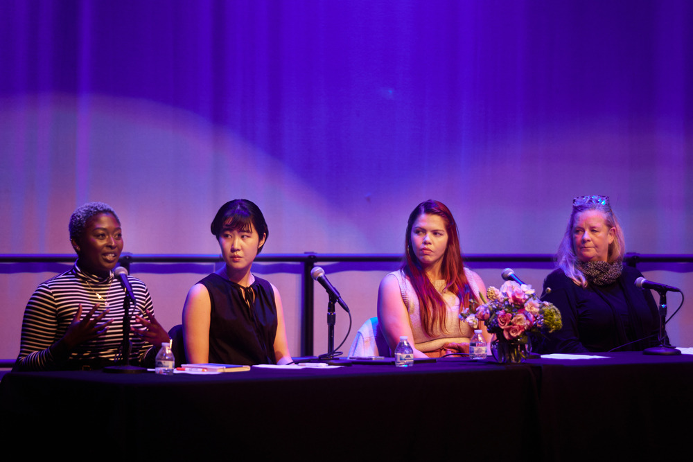 Anne Pearce, director of the creative arts program, Soka alumnus Giselle Velasquez ’15, Nappa Kataoka ’23, and Wilnie Merilien, resident hall coordinator sit on stage and speak during the “Voices of Women at Soka” event.