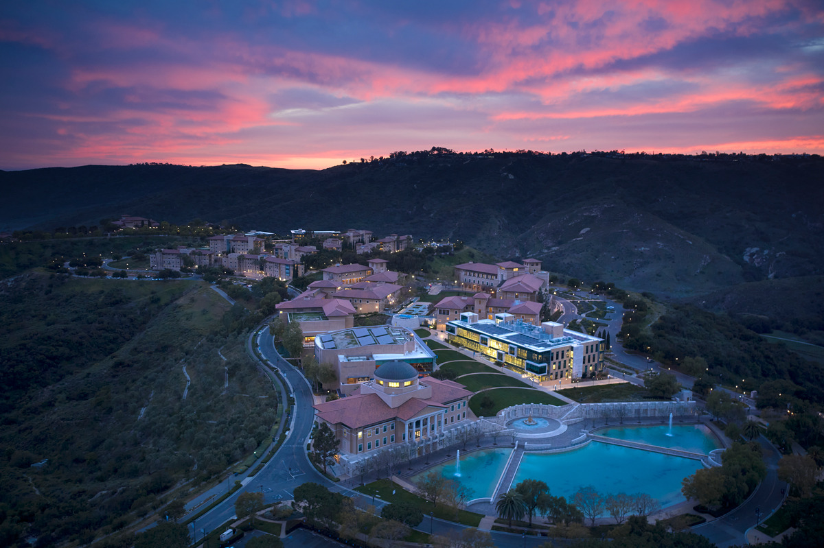 Aerial Drone image of Soka University of America's campus during sunset with a pink and purple sky