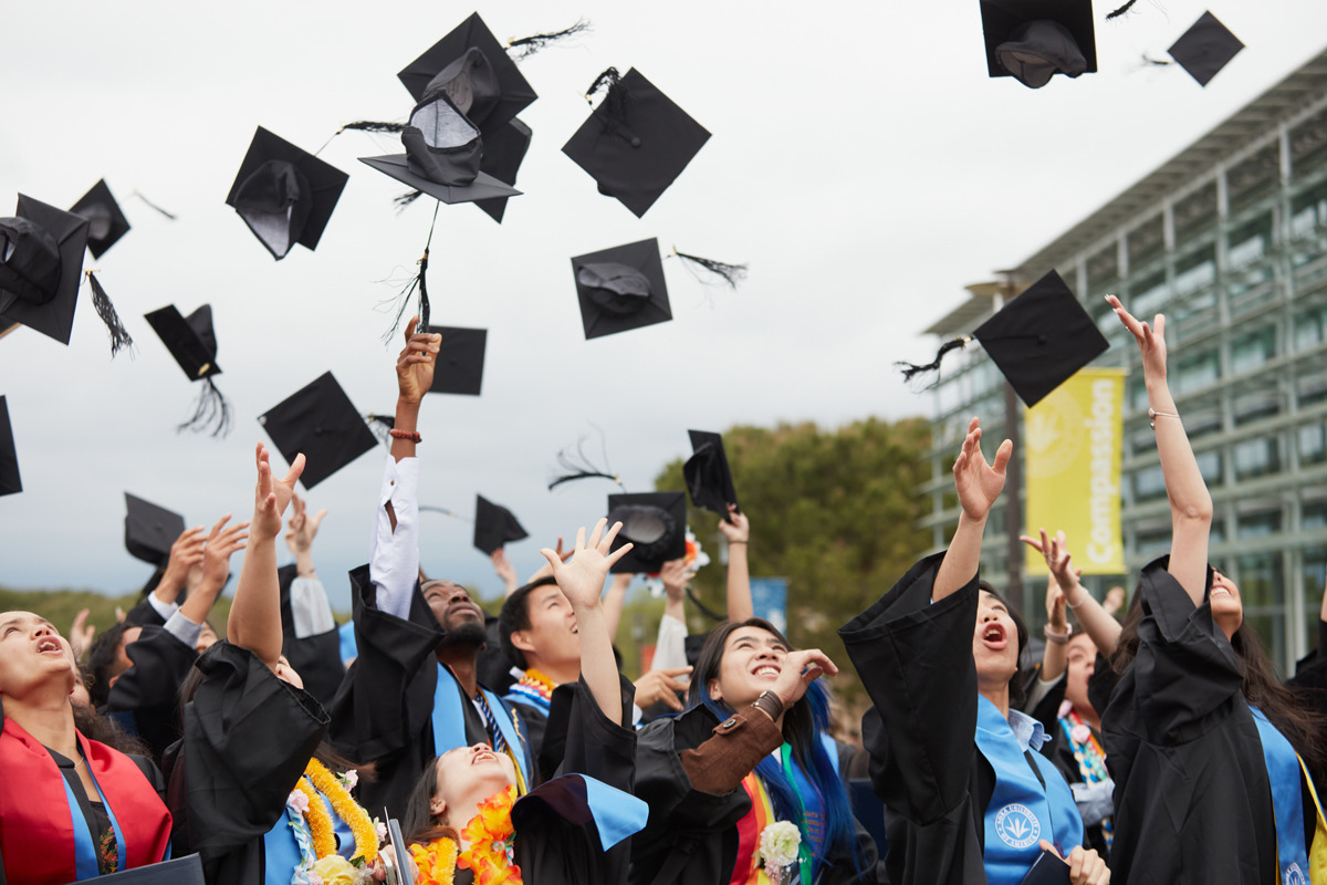 Soka's Class of 2023 throws their graduation caps in the air in celebration