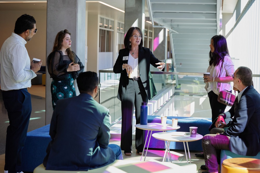 SUA’s Director of Special Projects Mary Patrick Kavanaugh speaks with the competition’s judges in Curie Hall