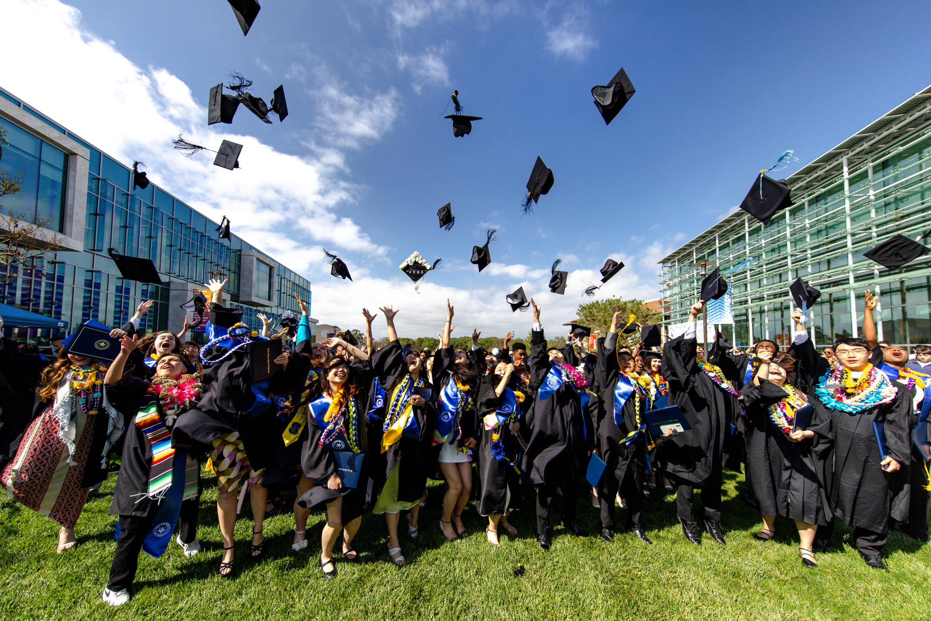 2024 SUA Graduates toss their caps in the air in celebration of commencement