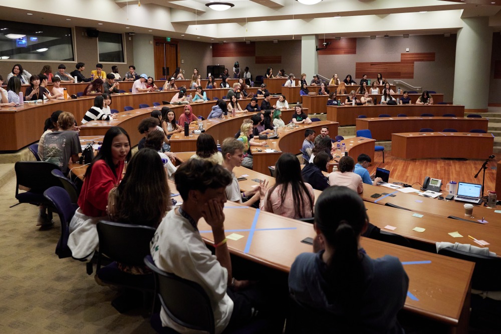 First Year students sit in a lecture hall during orientation